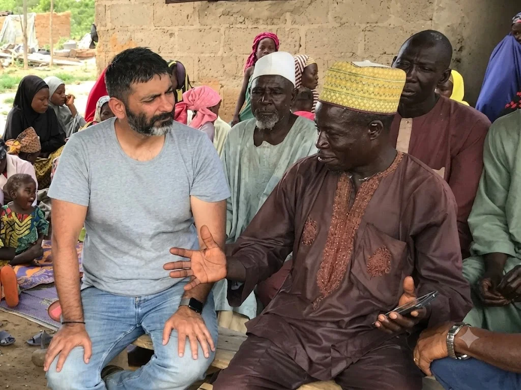 Good Earth leadership in dialogue with community elder and villagers